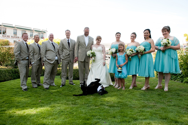 The wedding party posing with the wedding dog - bride is wearing champagne a-line dress, groom and groomsmen are wearing tan suits, and the bridesmaids are wearing aqua dresses - photo by Portland wedding photographer Barbie Hull 